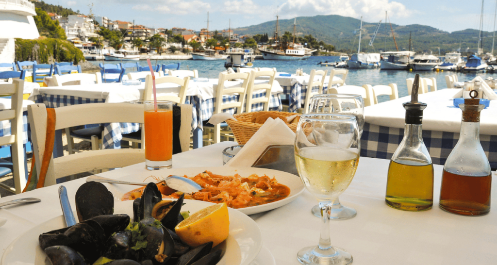 greek taverna serving seafood near the beach with a beautiful view of the sea